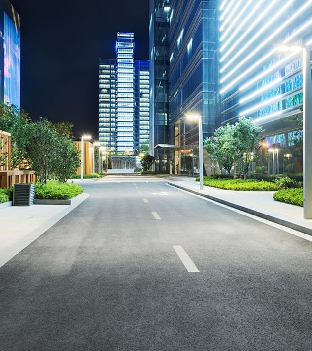 city empty traffic road with cityscape in background